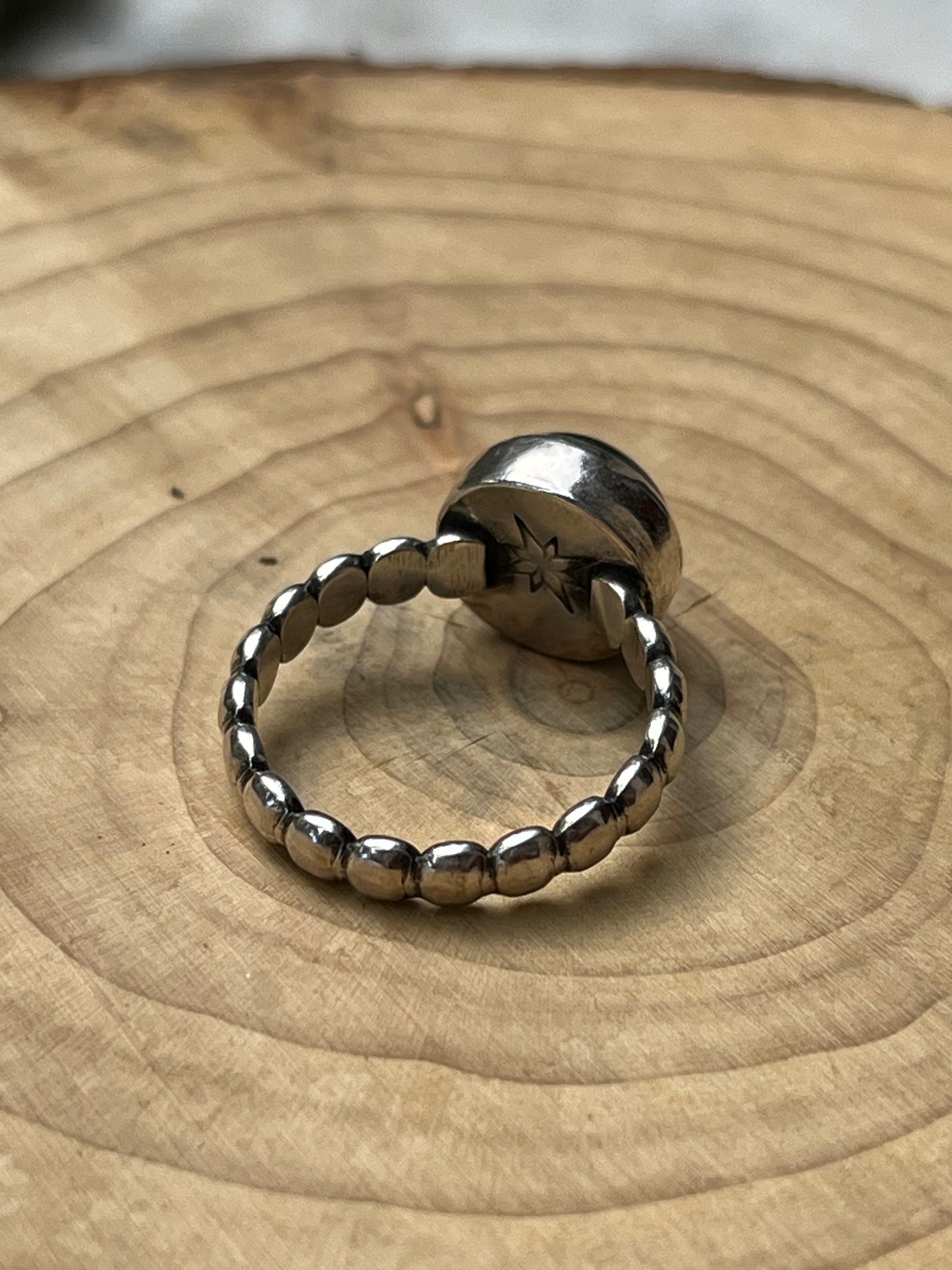 Round Black Moonstone with silver ball band.